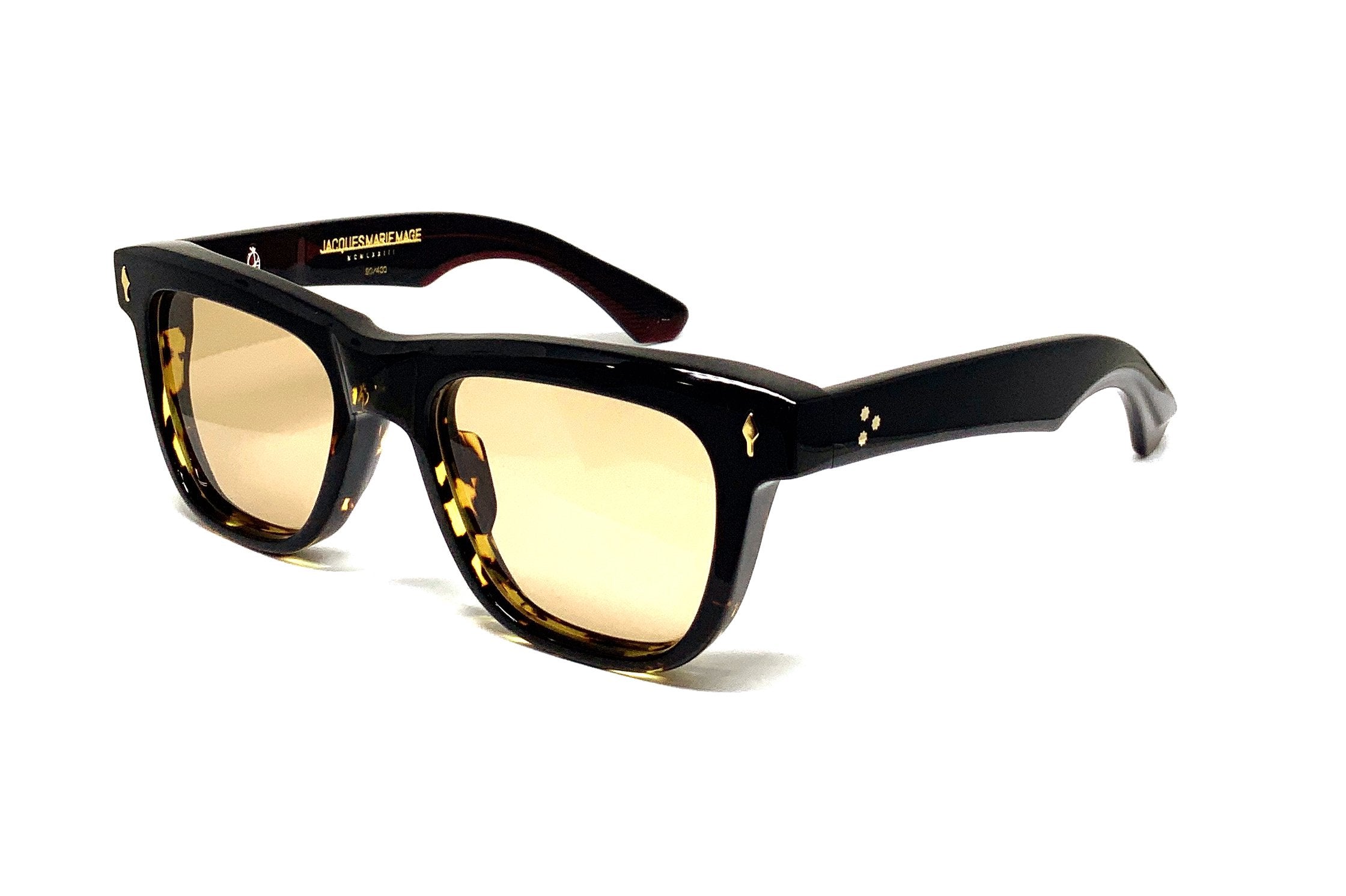 Three quarter view of thick black sunglasses frame with yellow tinted lenses
